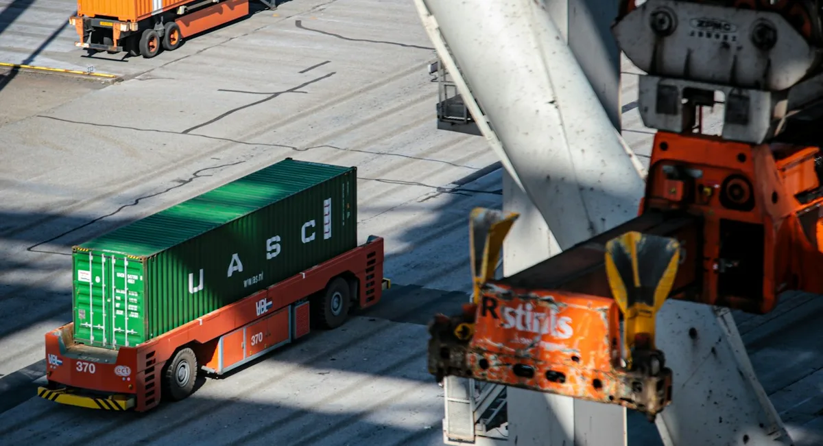 Freight containers moving through a logistics terminal for warehouse model comparison