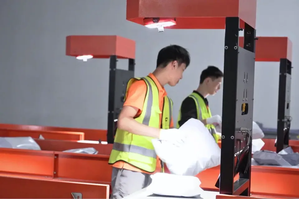 Order fulfillment team picking and packing parcels